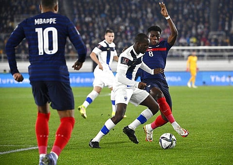 Finland's Glen Kamara, center, fights for the ball with France's Aurelien Tchouameni (Photo | AP)