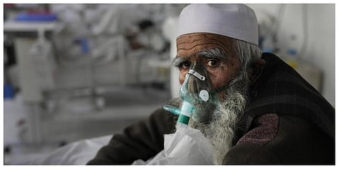 An Afghan patient infected with COVID-19 sits on a bed in the intensive care unit of the Afghan Japan Communicable Disease Hospital, in Kabul. (Photo: AP)