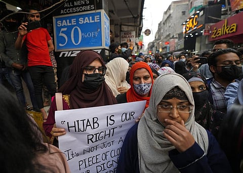 Muslim women participate in a march against banning Muslim girls wearing hijab from attending classes at some schools in Karnataka.