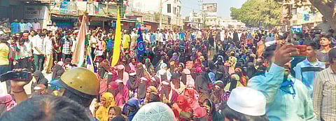 Students and their parents sit in protest at Banahatti town on Tuesday | EXPRESS