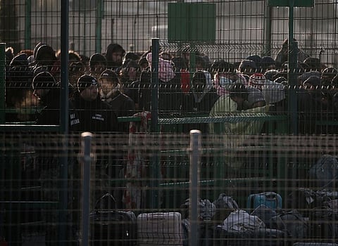 Refugees gather at the boarder after leaving Ukraine, at the Medyka border crossing in Poland. (Photo | AP)