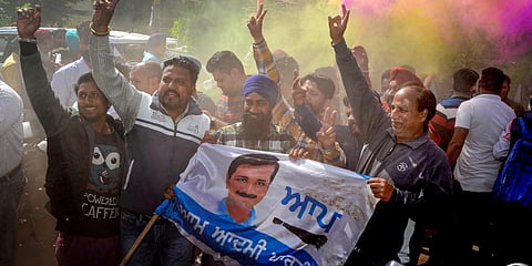 Aam Aadmi Party supporters celebrate the party's landslide victory in the Punjab Assembly elections. (Photo | PTI)