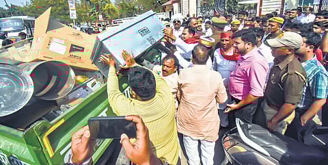 SP workers check a loaded truck for EVMs in Gorakhpur on Wednesday. (Photo | PTI)