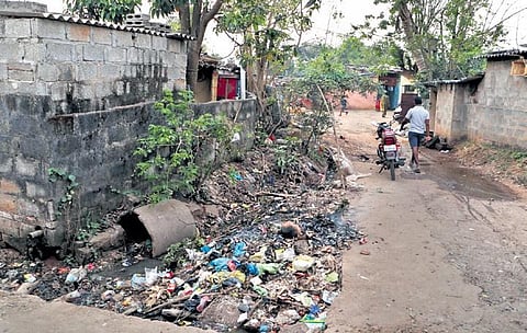 An overflowing drain in Salia Sahi slum I IRFANA