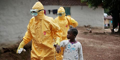 FILE - Nowa Paye, 9, is taken to an ambulance after showing signs of the Ebola infection in the village of Freeman Reserve, about 30 miles north of Monrovia, Liberia, Sept. 30, 2014. (Photo | AP)