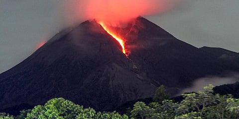 Lava flows down from the crater of Mount Merapi seen from Cangkringan village in Sleman, Yogyakarta, early Friday, March 11, 2022. (Photo | AP)