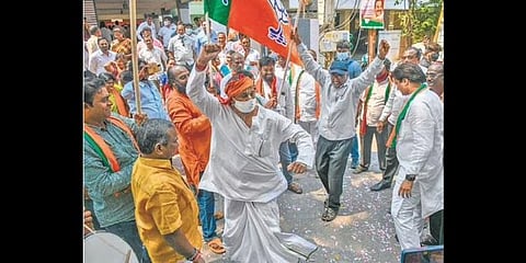 BJP cadre celebrate the victory of the party in the elections in four states, at its state office in Vijayawada on Thursday (Photo I Prasant Madugula)
