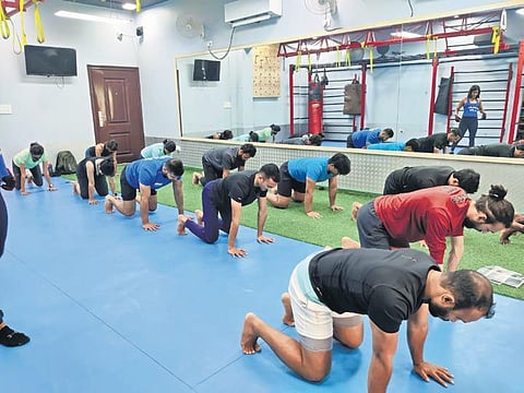 Participants practising the baby beast movement