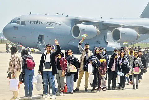 Indian nationals after deboarding from an IAF plane carrying evacuated people from war-hit Ukraine, at Hindon in Ghaziabad (Photo | Express)