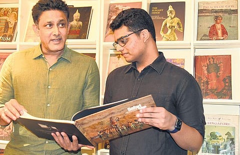 Anil Kumble (left) with his son Mayas Kumble during the latter’s launch of a coffee table book recently | Nagaraja Gadekal