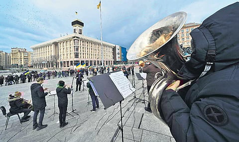 Musicians of the Kyiv-Classic Symphony Orchestra perform at the Independence Square in Kyiv on Mar 9, 2022, to call NATO to close the skies over Ukraine (Photo | AFP)