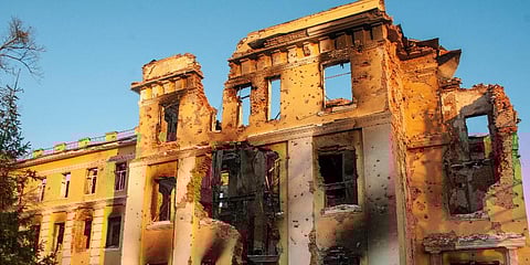 A building damaged by shelling is lit by sunset in Kharkiv, Ukraine, Friday, March 11, 2022. (Photo | AP)