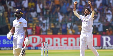 India's Jasprit Bumrah celebrates the wicket of Sri Lanka's Niroshan Dickwella during the second day of their 2nd Test match at Chinnaswamy Stadium in Bengaluru, March 13, 2022. (Photo | PTI)