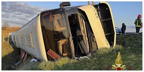 A bus lies on its side after overturning near Forli, Italy, Sunday, March 13, 2022. (Photo | AP)
