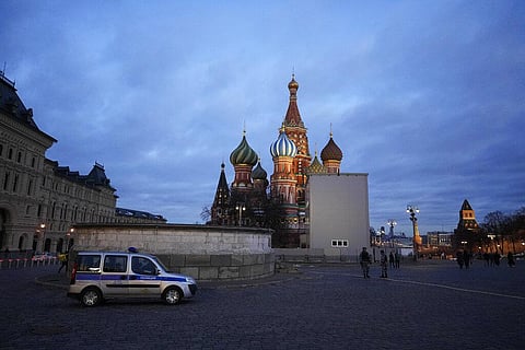 A police car is parked in Red Square, with St. Basil's Cathedral in the background, in Moscow, Russia, March 4, 2022. (Photo | AP)