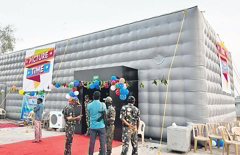 The exterior and interior (inset) areas of the digital mini-theatre company at Asifabad.