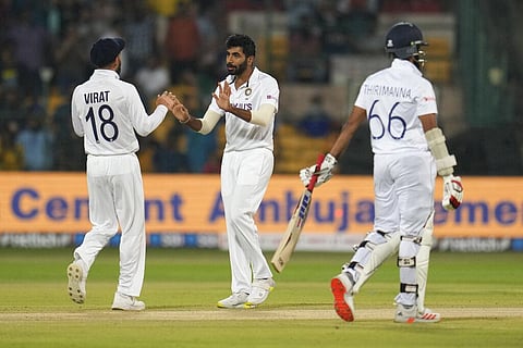 India's Jasprit Bumrah, center, celebrates with teammate Virat Kohli, left, after the dismissal of Sri Lanka's Lahiru Thirimanne. (Photo | AP)