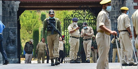 Security personnel stand guard as members of Delimitation Commission arrive to meet leaders of different political parties, in Srinagar. (File photo| PTI)