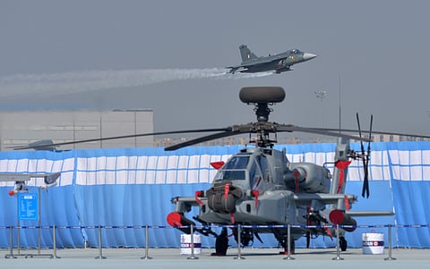 'Tejas' performs as an 'Apache' helicopter is seen parked in the foreground during the 87th Indian Air Force Day celebrations at Hindon Airbase. (File | PTI)