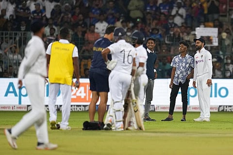 India's Virat Kohli, right, poses for a selfie with the young boys who intruded the pitch area during the second day of the second cricket test. (Photo | AP)