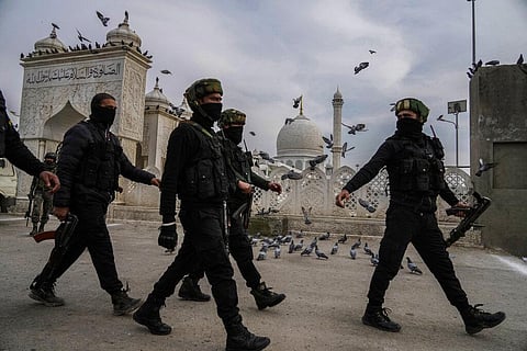 Jammu and Kashmir Special Operation Group (SOG) soldiers return back to their vehicles after a shootout outside Hazratbal shrine on the outskirts of Srinagar. (Photo | AP)