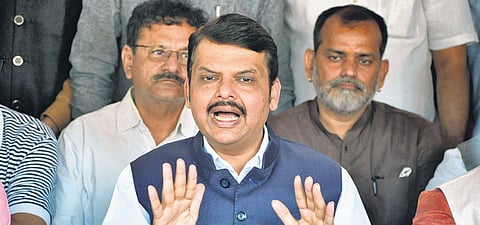 Devendra Fadnavis addresses the media at his residence in Mumbai on Sunday. (Photo | PTI)