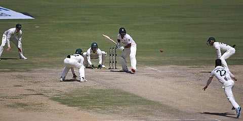 Pakistan's Azhar Ali (C) bats during the fourth day of the second Test match between Pakistan and Australia at the National Stadium in Karachi. (Photo | AP)