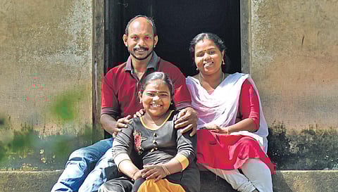 Devipriya with her parents Jayachandran and Rekha at their house | file pic