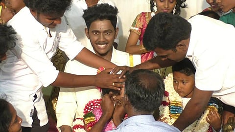 Family conduct ear piercing ceremony withsilicon statue of the deceased S Pandidurai. (Photo | EPS)
