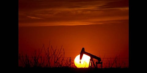 A pump jack operates as the Sun begins to set on the western horizon Monday, March 7, 2022, near Pleasant Farms in Texas(Photo | AP)