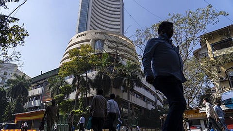 People walk past the Bombay Stock Exchange (BSE) building in Mumbai