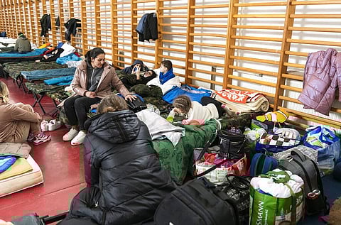 Refugees from Ukraine rest inside the help center of Beregsurany, near the Hungarian-Ukrainian border, Hungary, Wednesday, March 16, 2022. (Photo | AP)