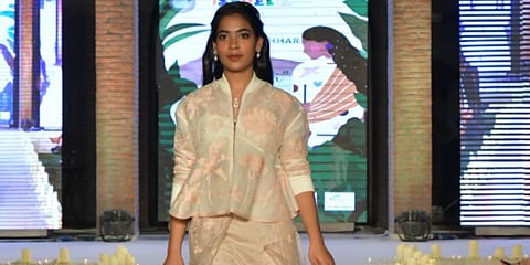 A girl from NGO Khushii walking the ramp in designer Sahil Kocchar's new collection for 'Amidi'. (Photo| EPS)