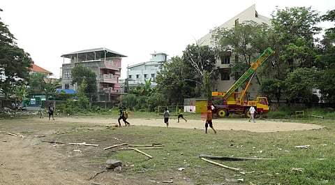 While a driving classs is underway on one side of the GCDA plot near Kaloor, children of the nearby places are seen playing football. (Photo | Arun Angela, EPS)