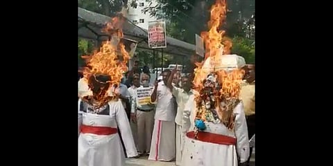 Laity activists burning cardinals in effigy in front of Kaloor Renewal Centre on Thursday.