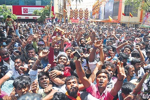 Fans of late actor Puneeth Rajkumar dance to celebrate his birth anniversary and the release of his movie ‘James’, on Thursday | Shriram BN