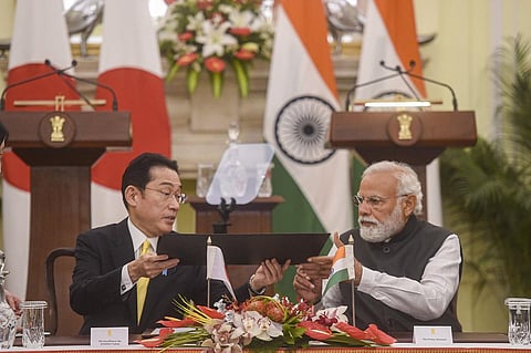 Prime Minister Narendra Modi and Japanese Prime Minister Fumio Kishida sign agreements, during the 14th India-Japan Annual Summit, at Hyderabad House, in New Delhi, Saturday. (Photo | PTI)