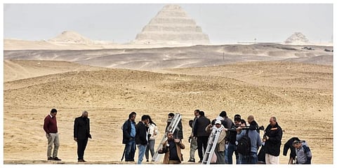 Reporters prepare to enter a recently discovered tomb near the famed Step Pyramid, in Saqqara, south of Cairo, Egypt, Saturday, March 19, 2022. (Photo | AP)