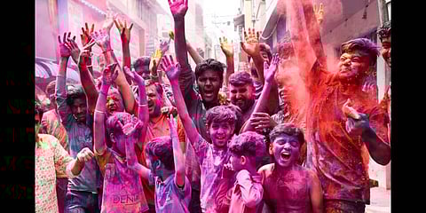 As Covid-19 cases are under control, Tiruchy’s Gujili Street witnessed a joyous Holi celebration with children painting the streets pink(Photo | EPS/ MK Ashok Kumar)