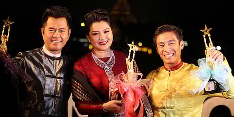 Myanmarese actors Lu Min, Thet Mon Myint and Tun Tun pose for a photo with trophies at the Myanmar Motion Picture Award Ceremony in Yangon. (File photo| AP)