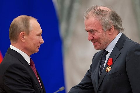 Russian President Vladimir Putin, left, presents a medal to then Mariinsky Theatre's Artistic Director Valery Gergiev, during an awarding ceremony in Moscow's Kremlin, Russia. ( Photo | AP)