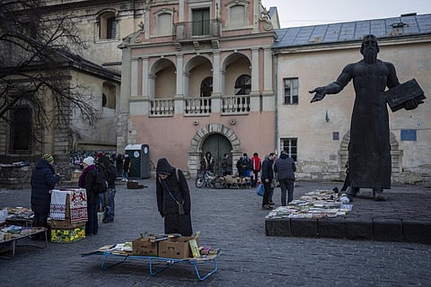 People roam around a used-books street market in downtown Lviv, Western Ukraine, Saturday, March 19, 2022. (Photo | AP)