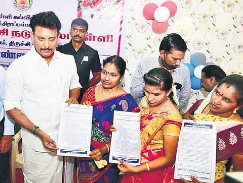 School edu minister Anbil Mahesh Poyyamozhi distributes SMC awareness pamphlets to parents in Tiruchy