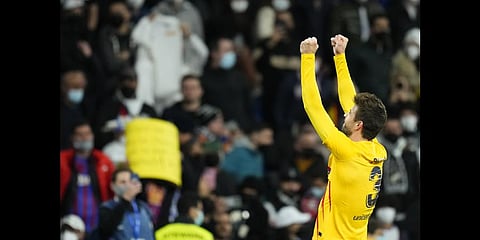 Barcelona's Gerard Pique celebrates end of the Spanish La Liga soccer match between Rial Madrid and FC Barcelona at the Santiago Bernabeu stadium in Madrid, Spain, Sunday, March 20, 2022.(Photo | AP)