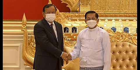 Myanmar State Administration Council Chairman Senior General Min Aung Hlaing, right, shakes hands with Cambodian Foreign Minister and ASEAN Special Envoy to Myanmar Prak Sokhonn.(Photo | AP)
