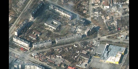 This satellite image provided by Maxar Technologies on Friday, March 18, 2022 shows damaged and burning apartment buildings and stores in Mariupol, Ukraine(Photo | AP)