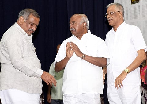 Law Minister J C Madhuswamy and MLC AH Vishwanath at a college alumni meet in Mysuru on Sunday. (Photo | Express)