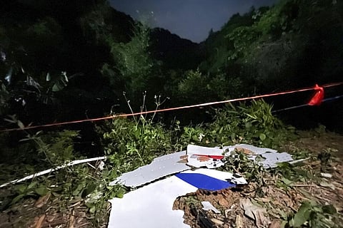 Debris is seen at the site of a plane crash in Tengxian County in southern China's Guangxi Zhuang Autonomous Region. (Photo | AP)