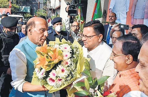 Pushkar Singh Dhami and Rajnath Singh in Dehradun on Monday. (Photo | PTI)