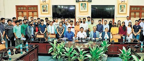 Health Minsiter Dr K Sudhakar meets Karnataka students who were evacuated from war-torn Ukraine, at Vidhana Soudha in Bengaluru on Monday